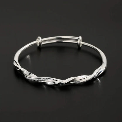 Bracelet torsadé argenté ajustable