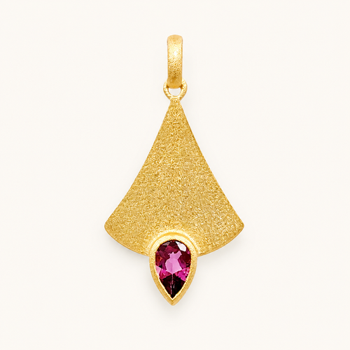 Pendentif en or avec pierre précieuse rose.