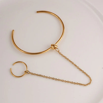 Bracelet manchette avec bague liée