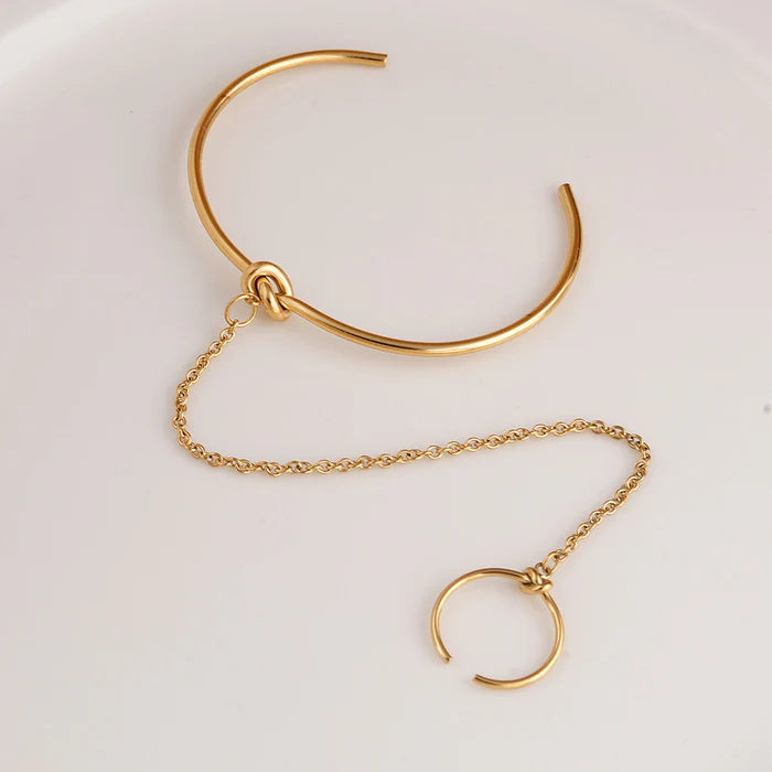 Bracelet manchette avec bague liée
