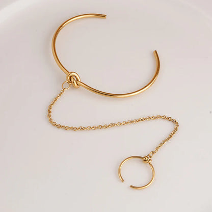 Bracelet manchette avec bague liée