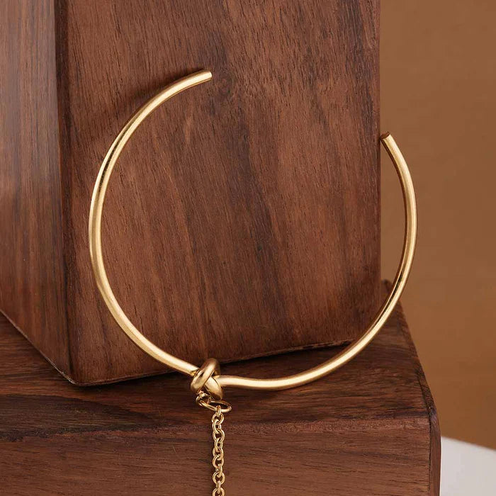 Bracelet manchette avec bague liée
