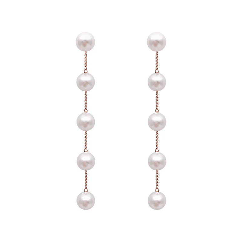 Boucles Pendantes à Perles Blanches