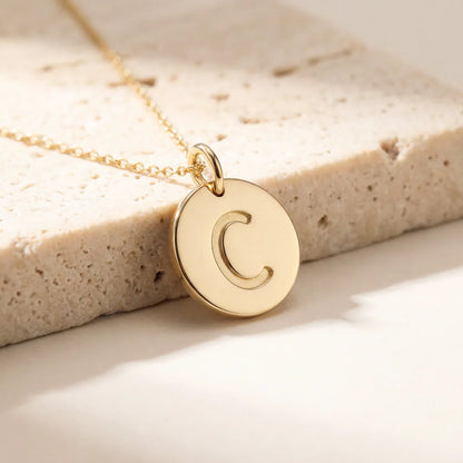 Collier médaille initiale