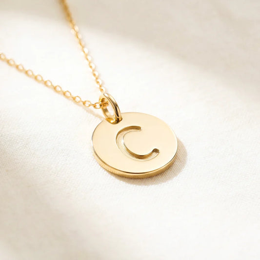 Collier médaille initiale